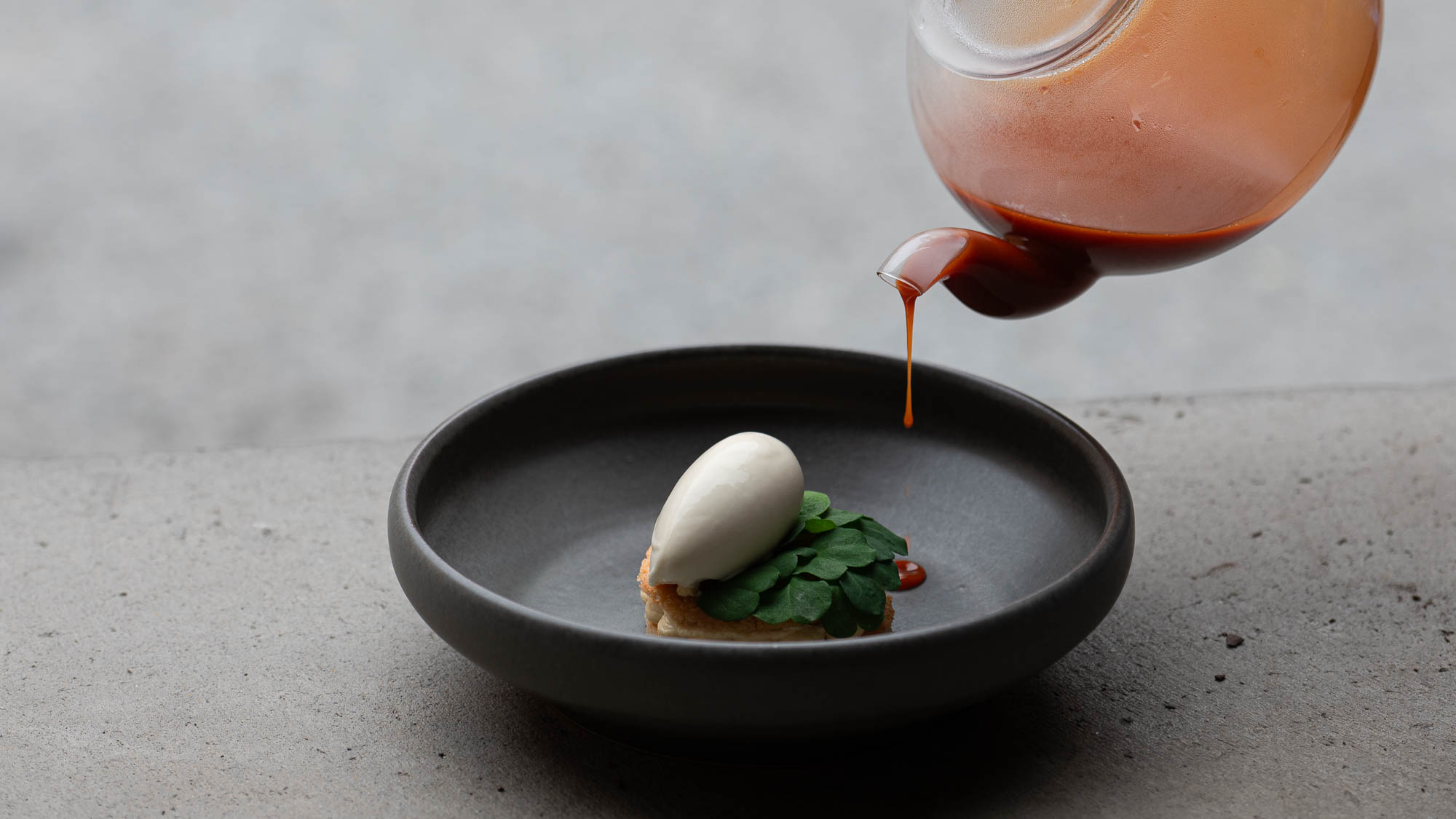 Rosehip soup with almond cake, brown butter cream, sweeet vernal grass ice cream and almond praline - Recept hos AVEQIA Stockholm